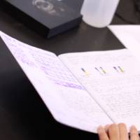 Student writing down notes